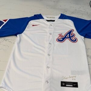 Austin Riley #27 Atlanta Braves Nike White and Blue Jersey with Red Accents.